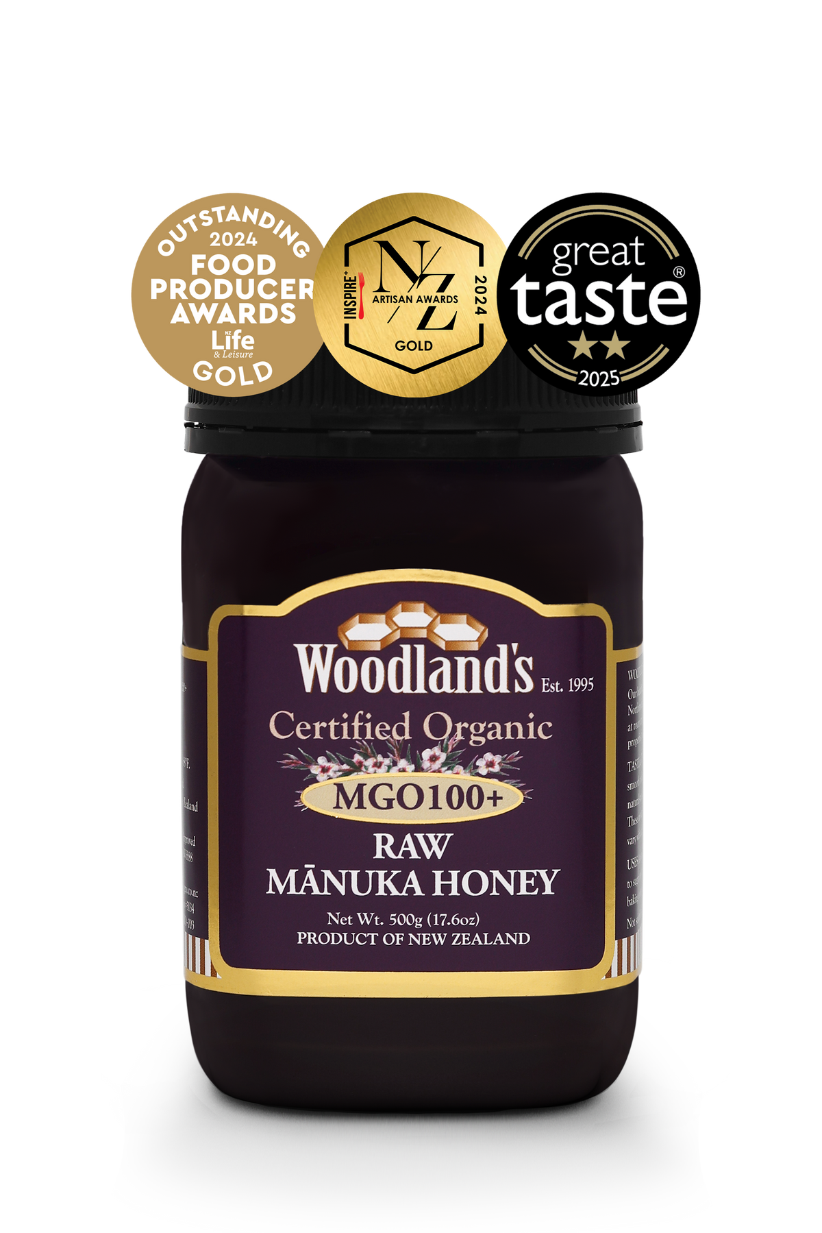Jar of WellNest MGO100+ Organic Raw Manuka Honey with gold label, 500g, showcasing the rich, golden honey inside.