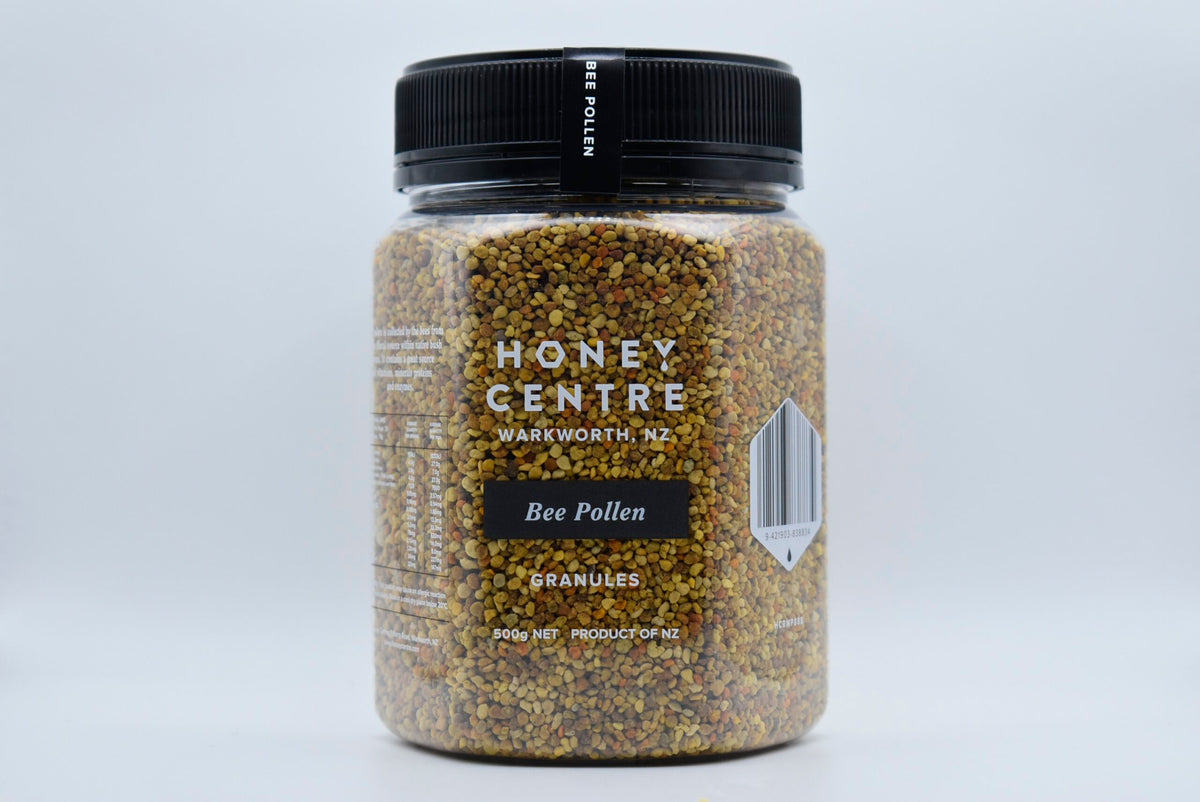 WellNest bee pollen granules in a clear jar, close-up view showing yellow pollen granules for natural bee pollen supplement.