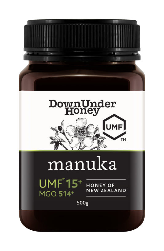 Amber jar of WellNest Manuka Honey UMF 15+ (MGO 514+) in a 500g container, showing the product label and honey inside.