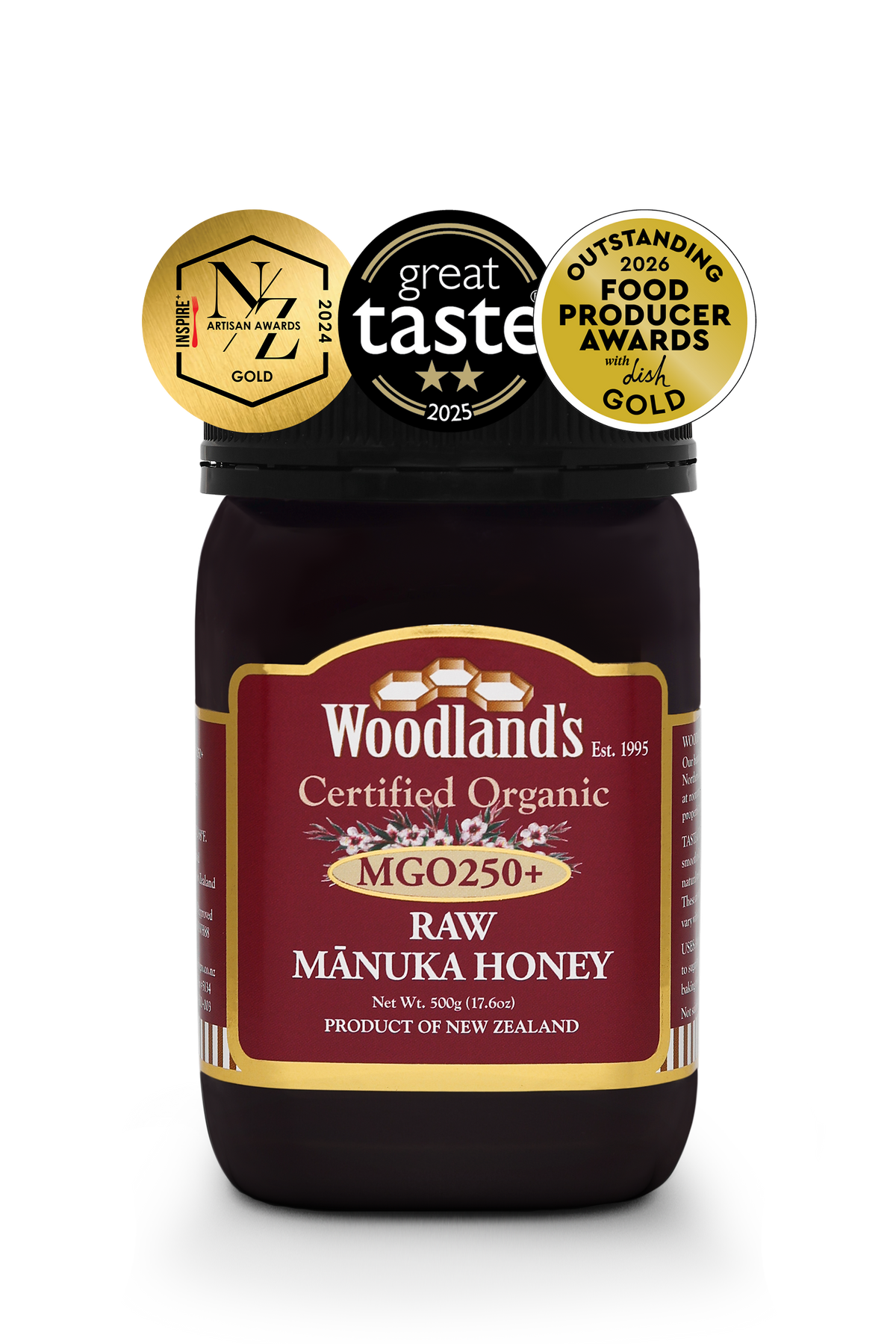 Organic raw Mānuka honey from WellNest in a 500g jar, featuring OFPA Silver and Gold labels, showcasing rich, golden honey.