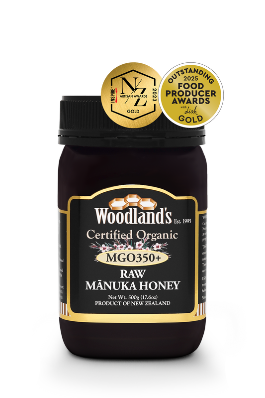 Organic raw Mānuka honey from WellNest, MGO350+ Manuka honey in a 500g jar with golden label and natural honey appearance.