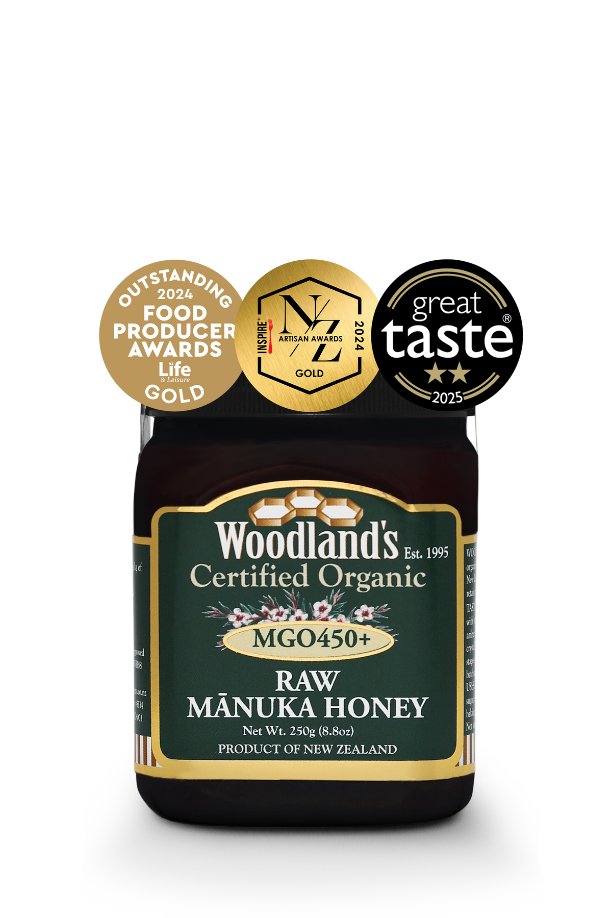 Jar of WellNest MGO450+ Organic Raw Manuka Honey in a 250g glass container with a gold label and natural honey inside.