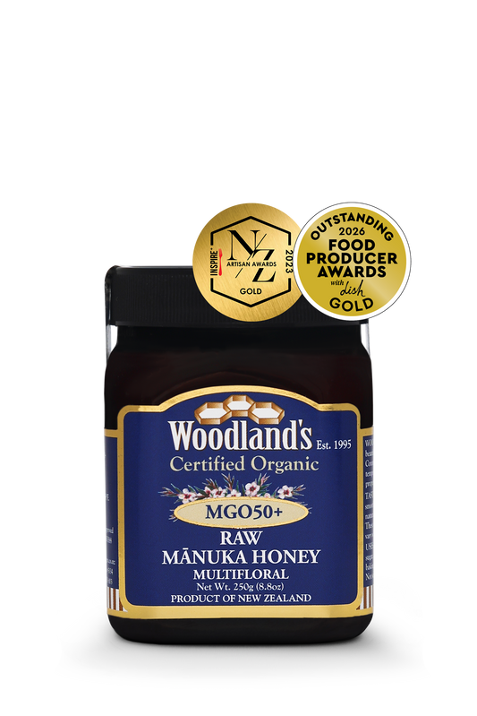 Organic raw Mānuka honey with MGO50+ from WellNest, showcasing a 250g jar of multifloral Manuka honey with golden color.