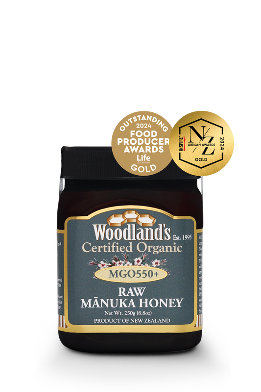 Jar of WellNest MGO550+ Organic Raw Manuka Honey in a 250g container, featuring the FPA Gold 24+ AA Gold label.