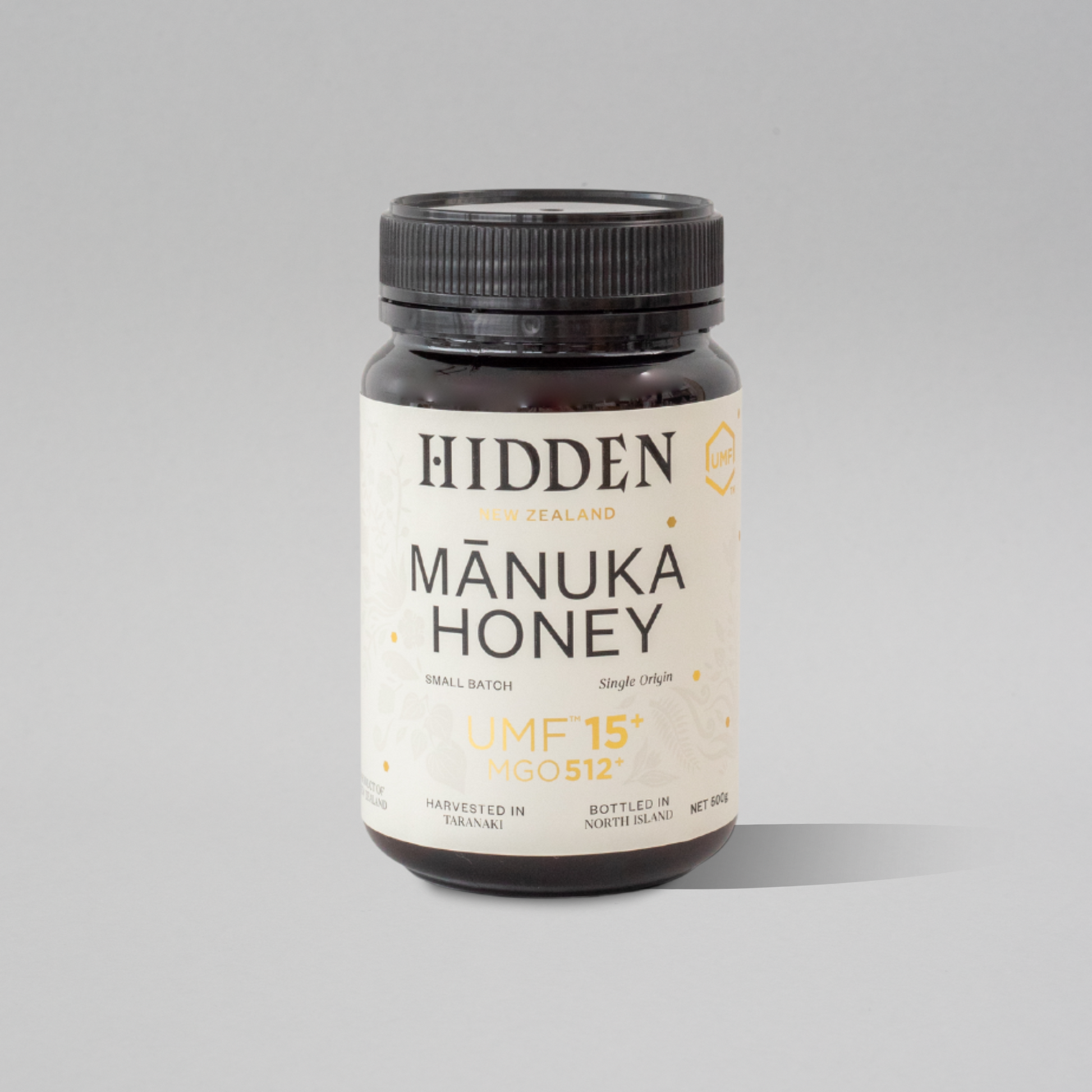 Jar of WellNest UMF15+ Manuka Honey with MGO512+ label, 500g container showing golden honey inside.