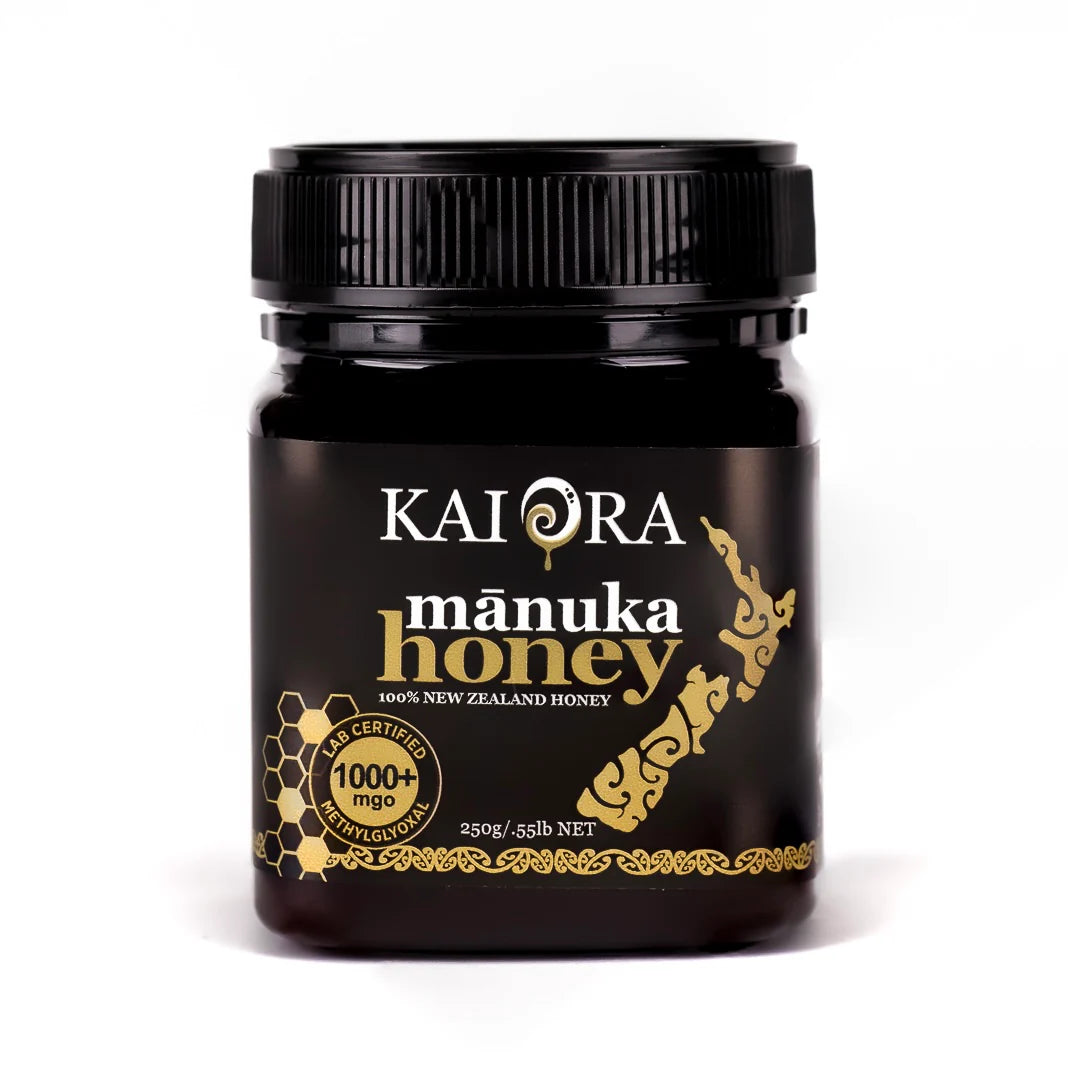 Jar of WellNest Kai Ora Black Label Manuka Honey with 1000+ MGO, showing the dark honey and label details.