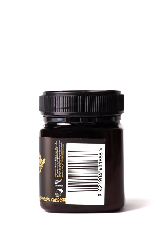 Jar of WellNest Kai Ora Black Label Manuka Honey with 1000+ MGO, showcasing the dark, rich honey inside the glass container.