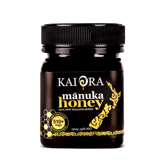 Jar of WellNest 510+ MGO Manuka Honey Kai Ora Black Label with golden honey inside, labeled with black and gold design.