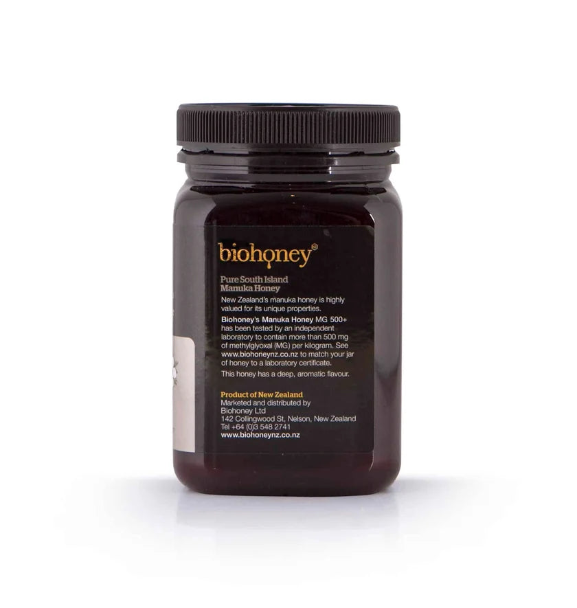 A 500g jar of WellNest Manuka Honey MGO 500+ in a clear glass jar with a gold lid, showcasing the honey's rich, golden color.
