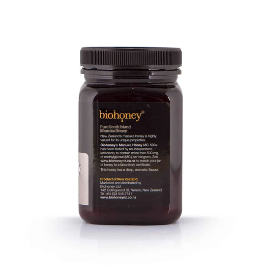 A 500g jar of WellNest Manuka Honey MGO 500+ in a clear glass jar with a gold lid, showcasing the honey's rich, golden color.