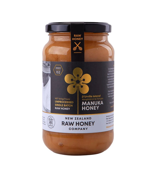 Raw Manuka Honey from WellNest, MGO152+, 500g jar showing golden honey with label and natural honey texture.