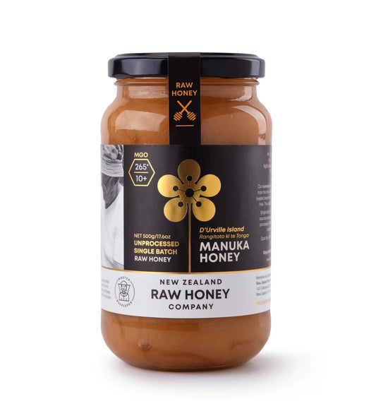 Raw Manuka Honey WellNest MGO265+ 500g jar with label and honey inside, showcasing natural, golden Manuka honey in a jar.