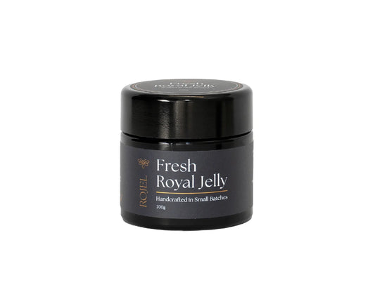Fresh New Zealand Royal Jelly in a 100g jar by WellNest, showing the creamy, golden-colored royal jelly in a glass container.